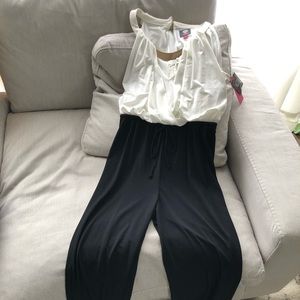 Classy white/ black jumpsuit with gold neck detail